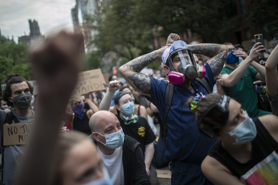 Protesters sit during a solidarity rally calling for justice over the death of George Floyd, Wednesday, June 3, 2020, in New York. Floyd died after being restrained by Minneapolis police officers on May 25. (AP Photo/Wong Maye-E)