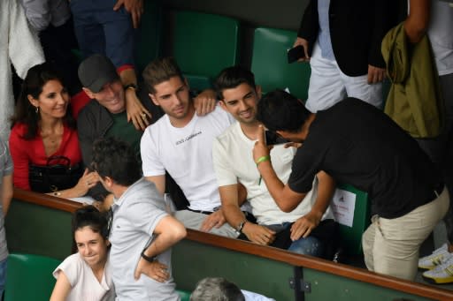 Cheese: French football legend Zinedine Zidane poses for a photo with his family in the stands