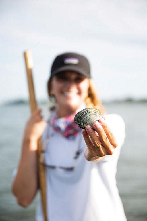 Emily Whipple shows off her prize, the ubiquitous quahog.