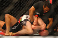 Referee Herb Dean stops the fight as Martin Kampmann of Denmark submits Thiago Alves of Brazil during the UFC On FX welterweight bout at Allphones Arena on March 3, 2012 in Sydney, Australia. (Photo by Mark Kolbe/Getty Images)