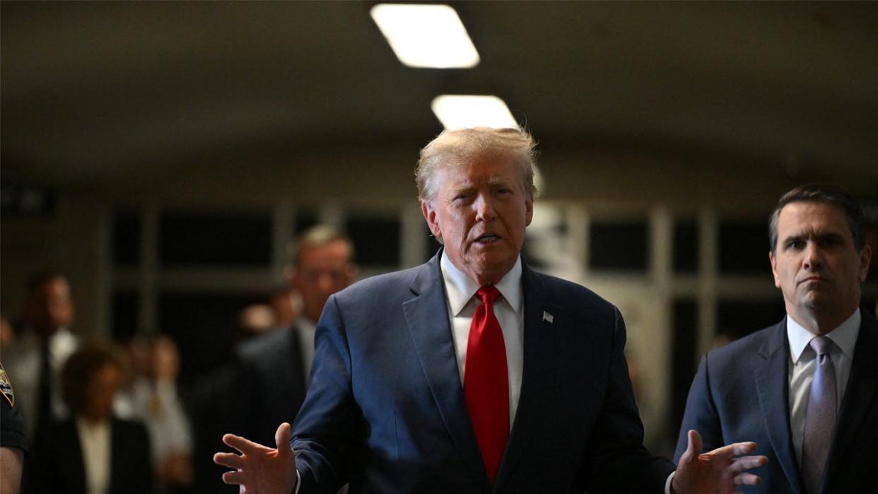 <div>Former US President Donald Trump speaks to the press as he arrives at Manhattan Criminal Court for a hearing in his case of paying hush money to cover up extramarital affairs in New York City on February 15, 2024. <strong>(Photo by ANGELA WEISS/AFP via Getty Images)</strong></div>