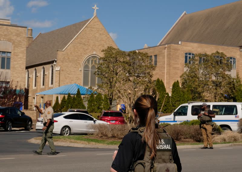 Law enforcement officers and members of the U.S. marshalls work at a family reunification center after a mass shooting at the Covenant School in Nashville