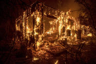 <p>Flames consume a home as a wildfire burns in Ojai, Calif., on Thursday, Dec. 7, 2017. (Photo: Noah Berger/AP) </p>