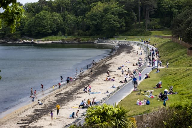 Crowds gather at the beach and along the footpath at Helen’s Bay in Co Down