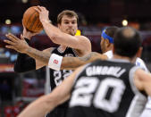 LOS ANGELES, CA - MAY 20: Tiago Splitter #22 of the San Antonio Spurs looks to pass the ball to teammate Manu Ginobili #20 as he is guarded by Kenyon Martin #2 of the Los Angeles Clippers in Game Four of the Western Conference Semifinals in the 2012 NBA Playoffs on May 20, 2011 at Staples Center in Los Angeles, California. NOTE TO USER: User expressly acknowledges and agrees that, by downloading and or using this photograph, User is consenting to the terms and conditions of the Getty Images License Agreement. (Photo by Harry How/Getty Images)