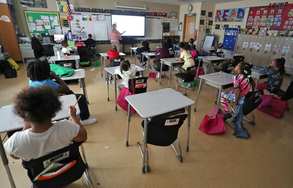 An empty desk in second grade teacher Tara Green's classroom at Helen Arnold Community Learning Center is designated for Tyren Thompson. The 7-year-old hasn't returned to school after being shot following a pee wee football game in Akron.