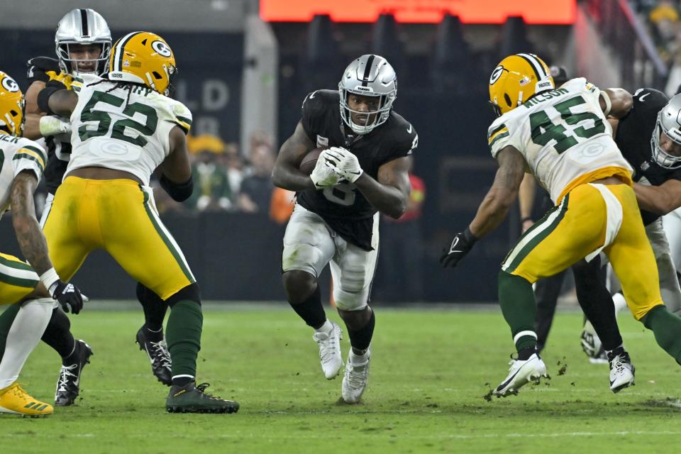 Las Vegas Raiders' Josh Jacobs runs during the second half of an NFL football game against the Green Bay Packers Monday, Oct. 9, 2023, in Las Vegas. (AP Photo/David Becker)