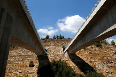 Two newly built bridges are seen from below during a media tour showcasing the last stages of the construction of a new high-speed railway between Tel Aviv and Jerusalem, near Jerusalem September 6, 2016. REUTERS/Ronen Zvulun/Files