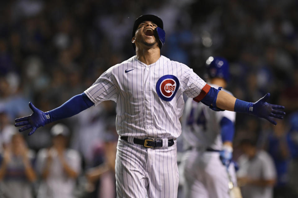 Chicago Cubs' Willson Contreras celebrates at the dugout after hitting a solo home run in the eighth inning of a baseball game against the Cincinnati Reds, Monday, July 26, 2021, in Chicago. (AP Photo/Paul Beaty)