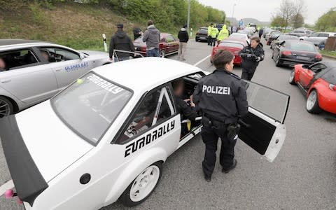 On suspicion of an illegal car race on the A20, dozens of cars are controlled by police at the Fuchsberg service station east of Wismar. - Credit: dpa picture alliance / Alamy Live News