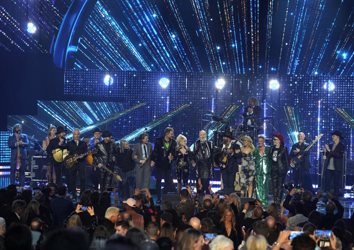 Neil Giraldo, from left, Dave Stewart, Pat Benatar, Brandi Carlile, Simon Le Bon, Dolly Parton, Rob Halford, Sheryl Crow, Pink, and Annie Lennox perform during the Rock & Roll Hall of Fame Induction Ceremony on Saturday, Nov. 5, 2022, at the Microsoft Theater in Los Angeles. (AP Photo/Chris Pizzello)