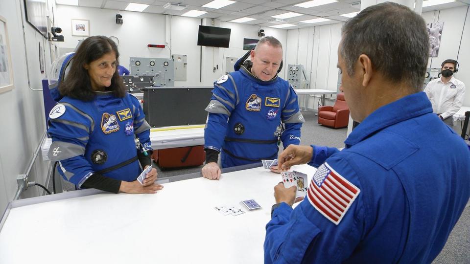 After suit-up and final fit checks, NASA’s Boeing Crew Flight Test astronauts Butch Wilmore and Suni Williams participate in a traditional game of cards inside the Neil A. Armstrong Operations and Checkout Building at NASA’s Kennedy Space Center in Florida during a launch attempt on Saturday, June 1, 2024. The crew members are preparing for launch to the International Space Station aboard Boeing’s Starliner spacecraft atop a United Launch Alliance Atlas V rocket from Space Launch Complex-41 at nearby Cape Canaveral Space Force Station. Liftoff was targeted for 12:25 p.m. EDT but scrubbed for the day.