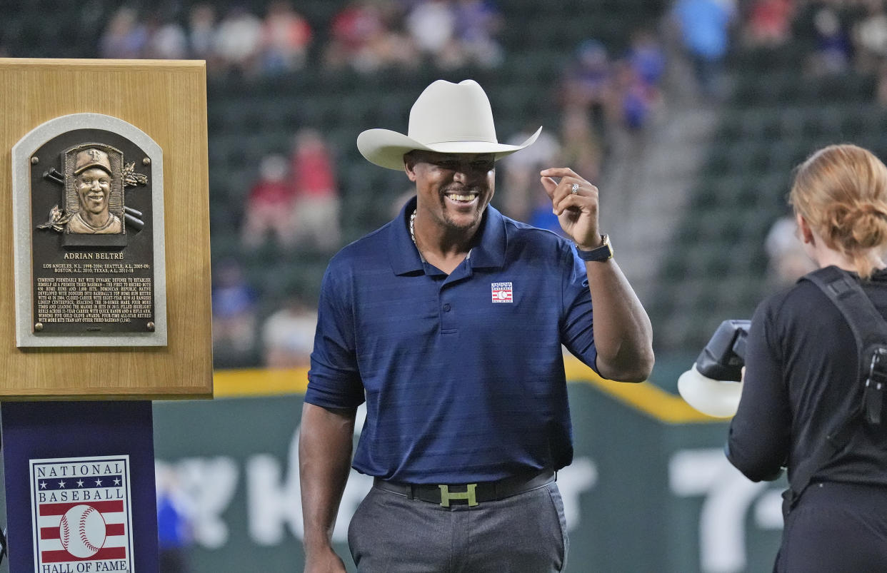 Former Texas Rangers third baseman Adrian Beltre smiles during for a ceremony to honor his induction into the Hall of Fame before a baseball game between the Minnesota Twins and Texas Rangers in Arlington, Texas, Saturday, Aug. 17, 2024. (AP Photo/LM Otero)