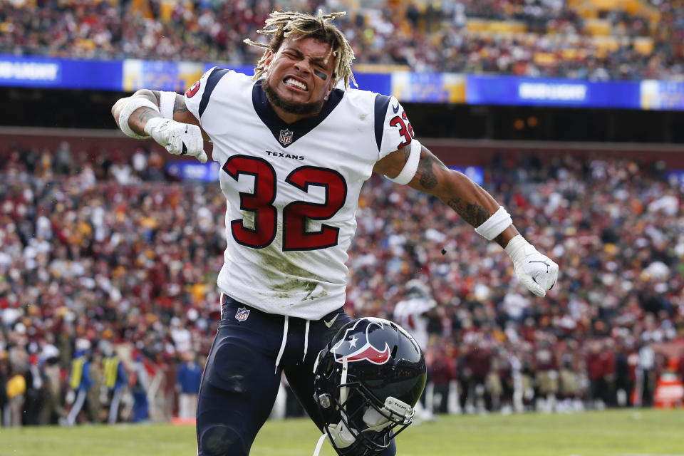 Houston Texans free safety Tyrann Mathieu (32) celebrates strong safety Justin Reid's interception and touchdown during the first half of an NFL football game against the Washington Redskins, Sunday, Nov. 18, 2018 in Landover, Md. (AP Photo/Alex Brandon)