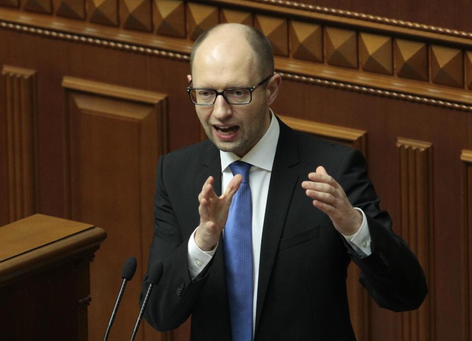 Ukrainian Prime Minister Arseniy Yatsenyuk, speaks to lawmakers during a session at the Ukrainian parliament in Kiev, Ukraine, Thursday, March. 27, 2014. (AP Photo/Sergei Chuzavkov)