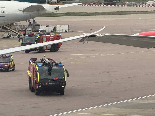 A Virgin Atlantic plane’s wing touching a British Airways aircraft