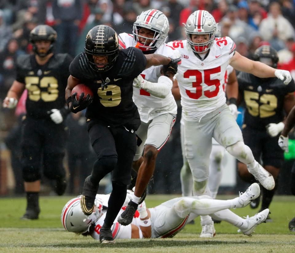 Purdue Boilermakers wide receiver Mershawn Rice (9) breaks the tackle of Ohio State Buckeyes safety Lathan Ransom (8) during the NCAA football game, Saturday, Oct. 14, 2023, at Ross-Ade Stadium in West Lafayette, Ind. Ohio State Buckeyes won 41-7.