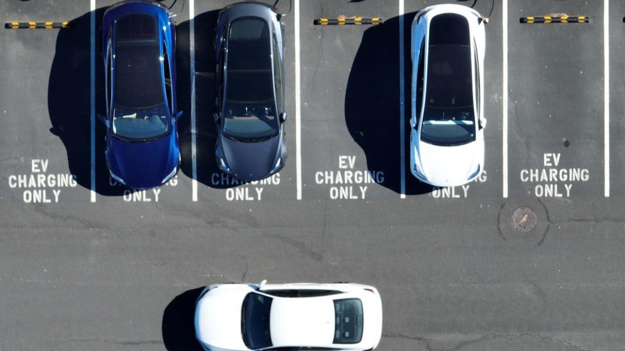 <div>In an aerial view, Tesla cars recharge at a Tesla charger station on February 15, 2023 in Corte Madera, California. (Photo by Justin Sullivan/Getty Images)</div> <strong>(Getty Images)</strong>