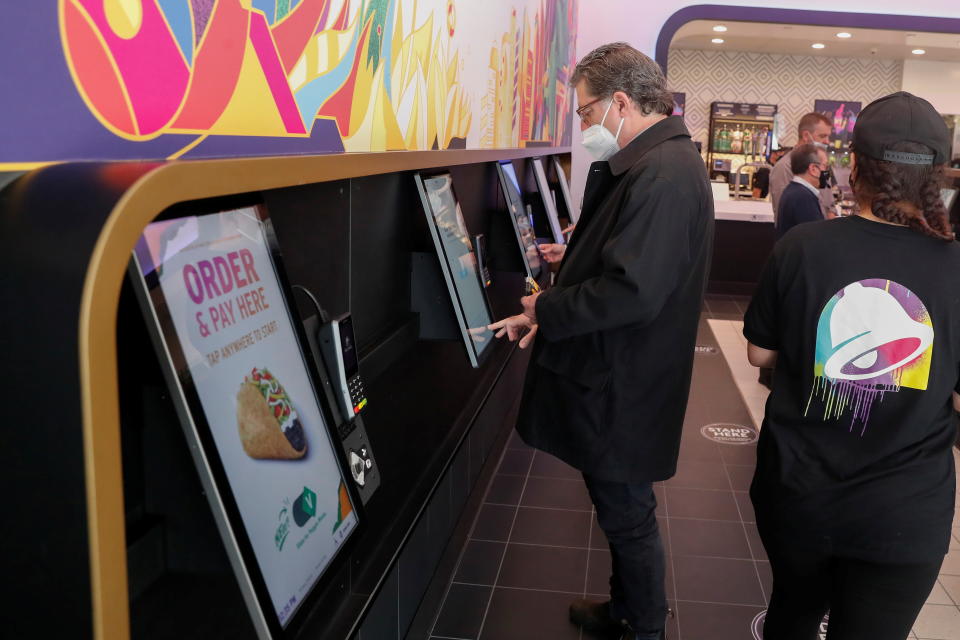  A customer orders at a Taco Bell digital kiosk inside the first digital-only U.S. cantina location at Times Square in New York City, U.S., April 14, 2021. REUTERS/Shannon Stapleton