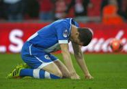 Wigan Athletic's Gary Caldwell reacts after their first penalty of a penalty shoot-out against Arsenal was saved, during their English FA Cup semi-final soccer match at Wembley Stadium in London April 12, 2014. REUTERS/Eddie Keogh (BRITAIN - Tags: SPORT SOCCER)