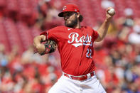 Cincinnati Reds' Wade Miley throws during the first inning of a baseball game against the Colorado Rockies in Cincinnati, Saturday, June 12, 2021. (AP Photo/Aaron Doster)