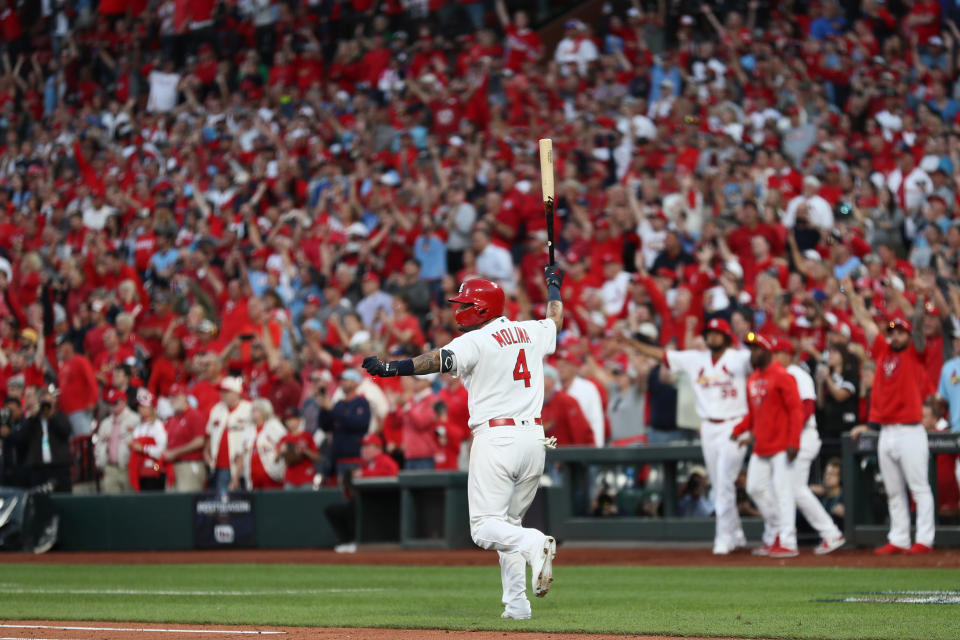 Yadier Molina celebrates his game-winning RBI against the Braves in Game 4 of the National League Division Series at Busch Stadium. (Photo by Jamie Squire/Getty Images)