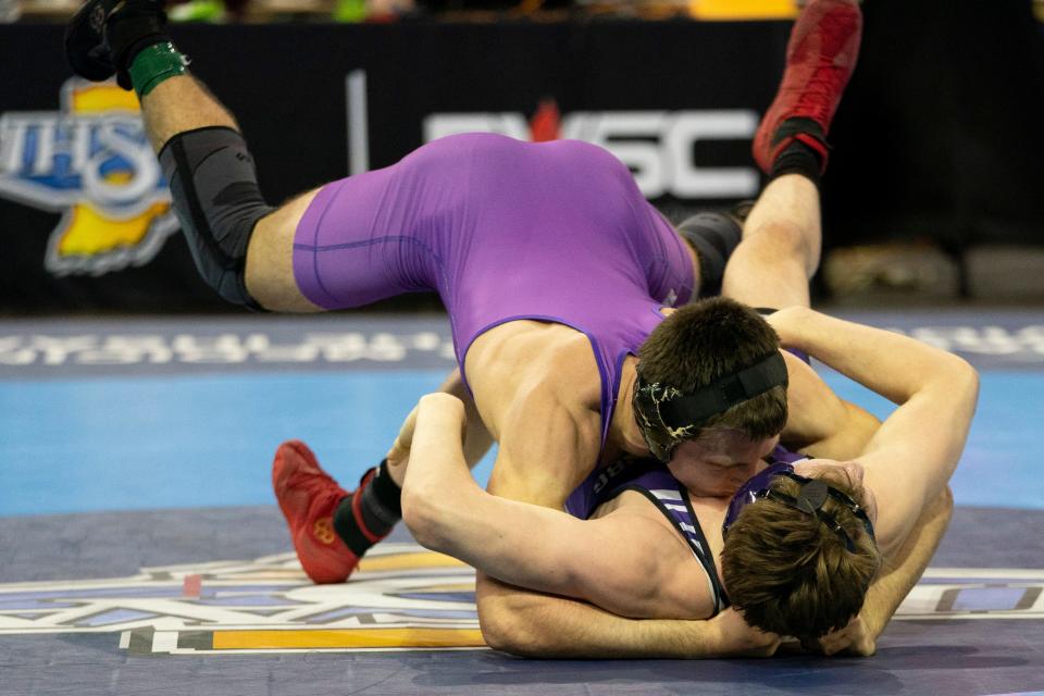 Bloomington South’s Evan Roudebush and Brownsburg’s Jess Derringer compete in the 165-pound championship match of the 2024 IHSAA Semi-State Wrestling tournament at Ford Center in Evansville, Ind., Feb. 10, 2024.