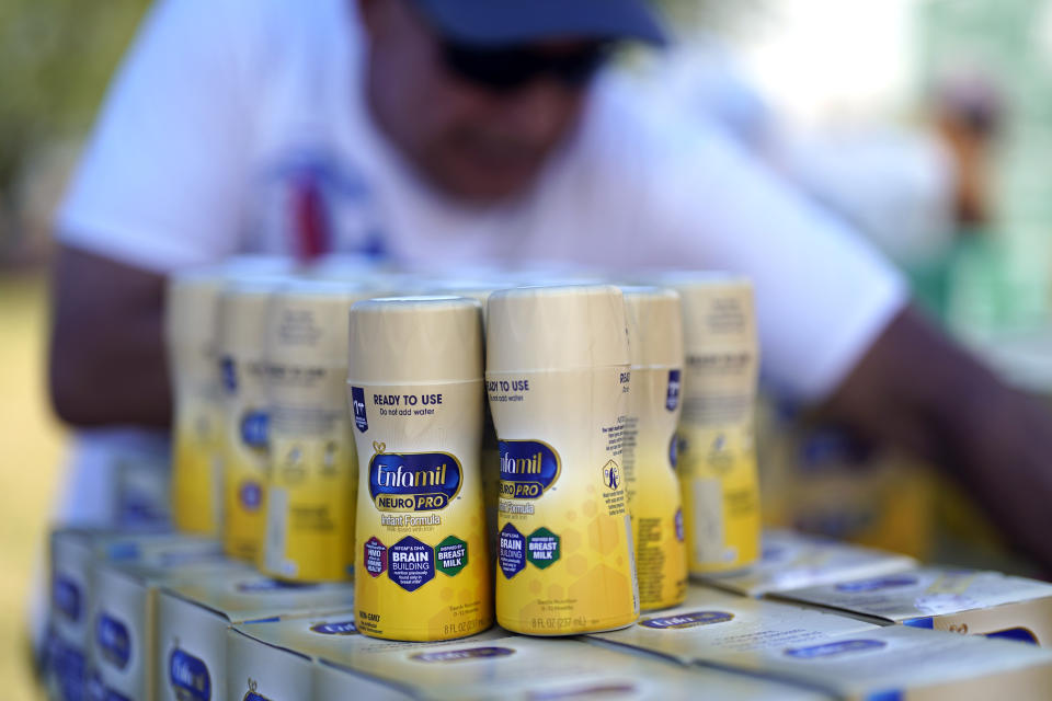 Infant formula is stacked on a table during a baby formula drive to help with the shortage Saturday, May 14, 2022, in Houston. Parents seeking baby formula are running into bare supermarket and pharmacy shelves in part because of ongoing supply disruptions and a recent safety recall. (AP Photo/David J. Phillip)