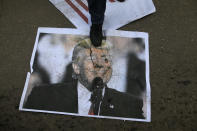 <p>A Palestinian protestor steps on a poster of President Donald Trump following his decision to recognise Jerusalem as the capital of Israel, in Gaza City, on Dec. 7, 2017. (Photo: Mohammed Abed/AFP/Getty Images) </p>