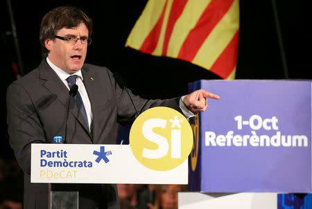 Catalan President Carles Puigdemont gestures during a rally urging supporters for a "yes" vote in the banned October 1 independence referendum in Sant Cugat, Spain, September 22, 2017. REUTERS/Albert Gea