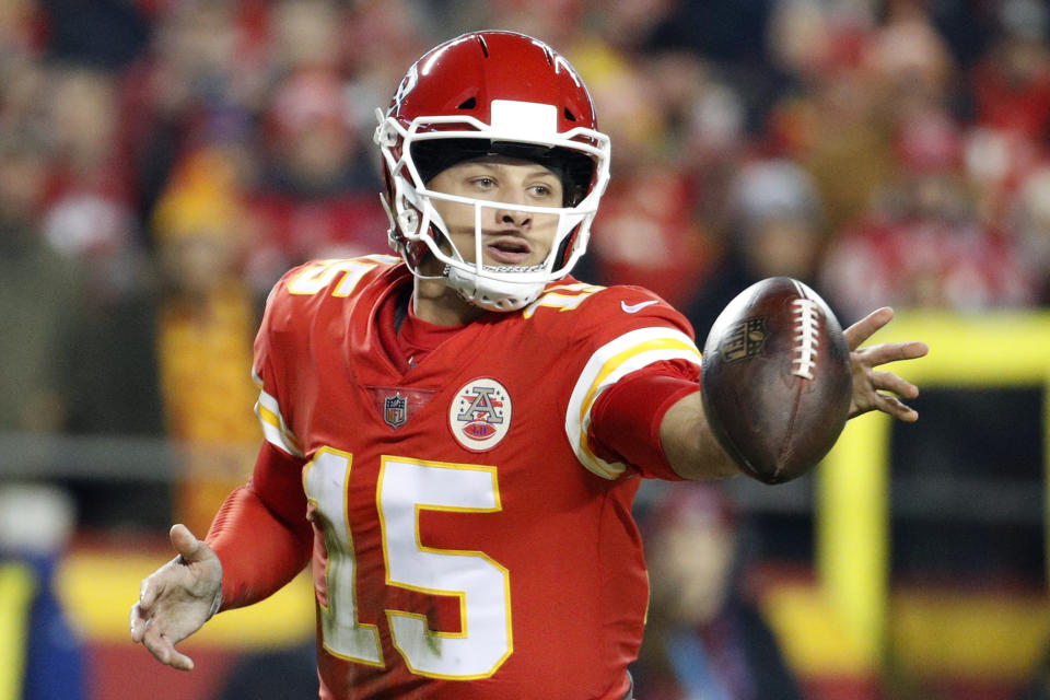 Kansas City Chiefs quarterback Patrick Mahomes (15) flips the ball during the first half of an NFL football game against the Los Angeles Chargers in Kansas City, Mo., Thursday, Dec. 13, 2018. (AP Photo/Charlie Riedel)
