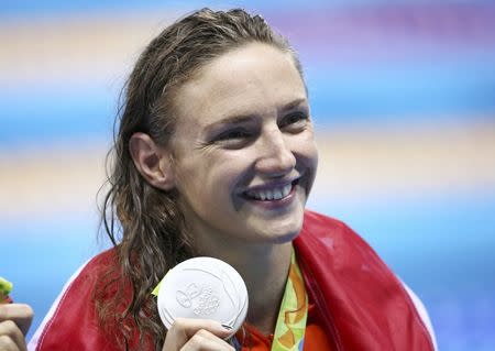 2016 Rio Olympics - Swimming - Victory Ceremony - Women's 200m Backstroke Victory Ceremony - Olympic Aquatics Stadium - Rio de Janeiro, Brazil - 12/08/2016. Katinka Hosszu (HUN) of Hungary celebrates with her silver medal after setting a new world record. REUTERS/Marcos Brindicci