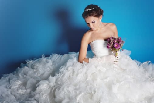 Bride wearing large wedding dress