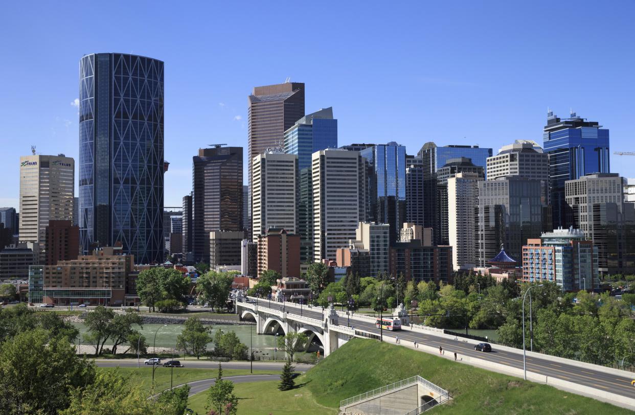 Downtown Calgary with the Centre Street Bridge and Bow River in the foreground at Calgary, Alberta on June 10, 2014. (Larry MacDougall, The Canadian Press)