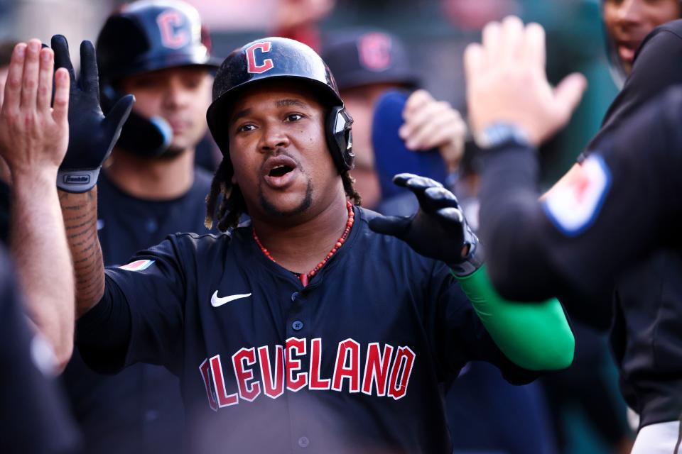 Cleveland Guardians' José Ramírez (11) celebrates in the dugout after hitting a home run against the Los Angeles Angels during the third inning Friday in Anaheim, California.