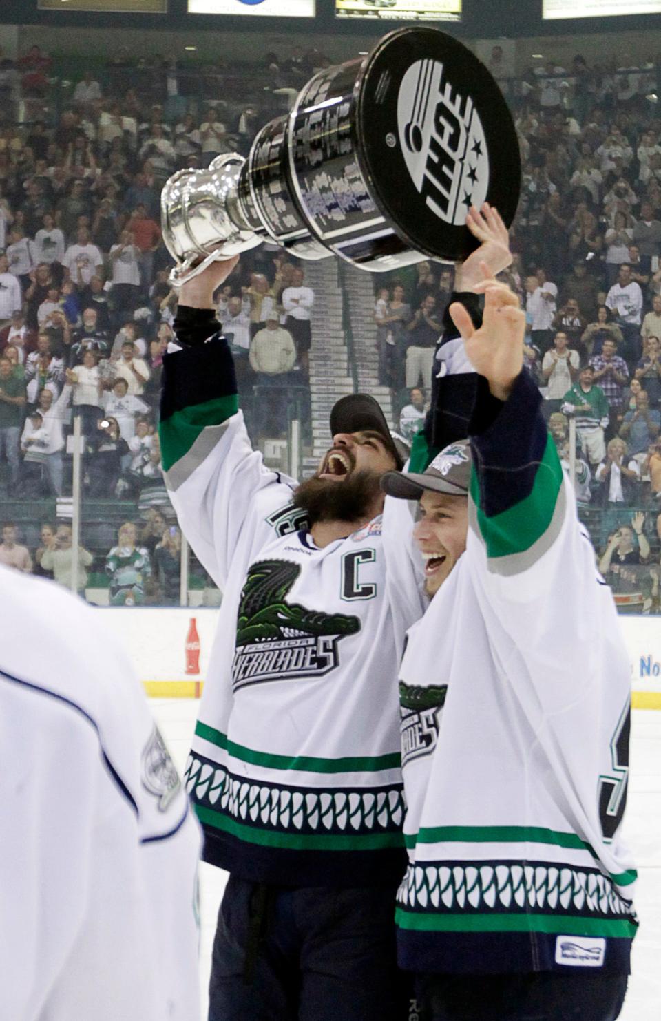 Everblades captain Mathieu Roy (15) holds the Kelly Cup after the Everblades won 3-2 in overtime clinching their first ECHL Kelly Cup over Las Vegas at Germain Arena on Wednesday, May 23, 2012.