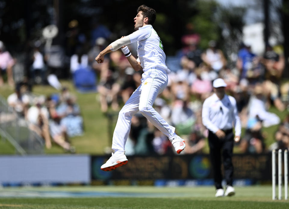 Pakistan bowler Shaheen Afridi celebrates the wicket of New Zealand's Tom Blundell during play on day one of the first cricket test between Pakistan and New Zealand at Bay Oval, Mount Maunganui, New Zealand, Saturday, Dec. 26, 2020. (Andrew Cornaga/Photosport via AP)