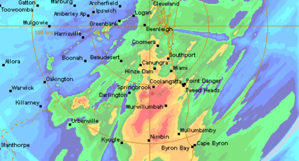 A weather map shows red and orange over Murwillumbah, Coolangatta and Byron Bay to indicate heavy rainfall. 