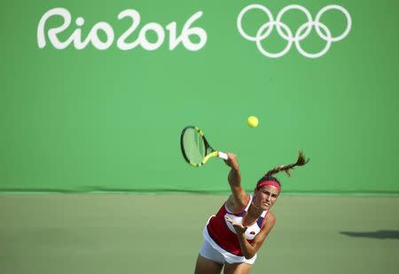 2016 Rio Olympics - Tennis - Preliminary - Women's Singles Third Round - Olympic Tennis Centre - Rio de Janeiro, Brazil - 09/08/2016. Monica Puig (PUR) of Puerto Rico in action against Garbine Muguruza (ESP) of Spain. REUTERS/Kevin Lamarque