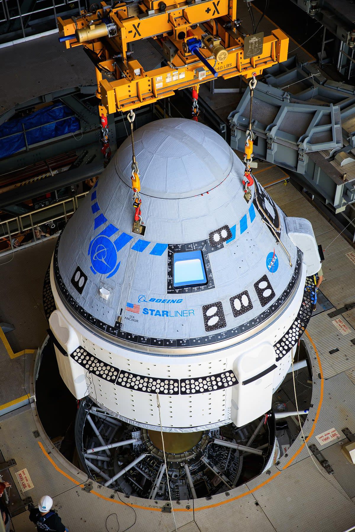 The Boeing CST-100 Starliner spacecraft being lifted at the Vertical Integration Facility in Florida's Cape Canaveral Space Force Station. (PA)