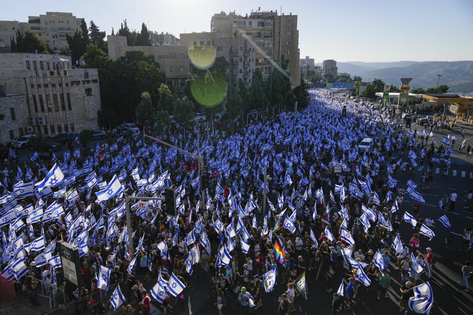 Thousands of Israelis march to Jerusalem in protest of plans by Prime Minister Benjamin Netanyahu's government to overhaul the judicial system, in Jerusalem, Saturday, July 22, 2023. Thousands of demonstrators entered the last leg of a four-day and nearly 70-kilometer (roughly 45-mile) trek from Tel Aviv to Jerusalem. Protest organizers planned to camp overnight outside Israel's parliament on Saturday. (AP Photo/Ohad Zwigenberg)