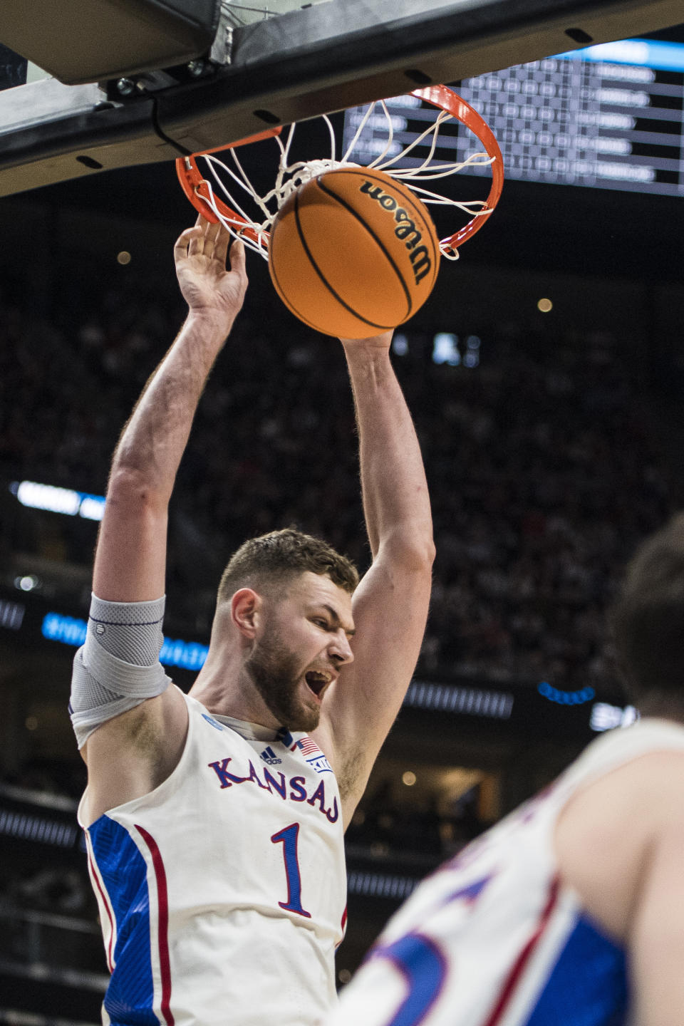 Kansas center Hunter Dickinson (1) dunks against Samford during the first half of a first-round college basketball game in the NCAA Tournament in Salt Lake City, Thursday, March 21, 2024. (AP Photo/Isaac Hale)