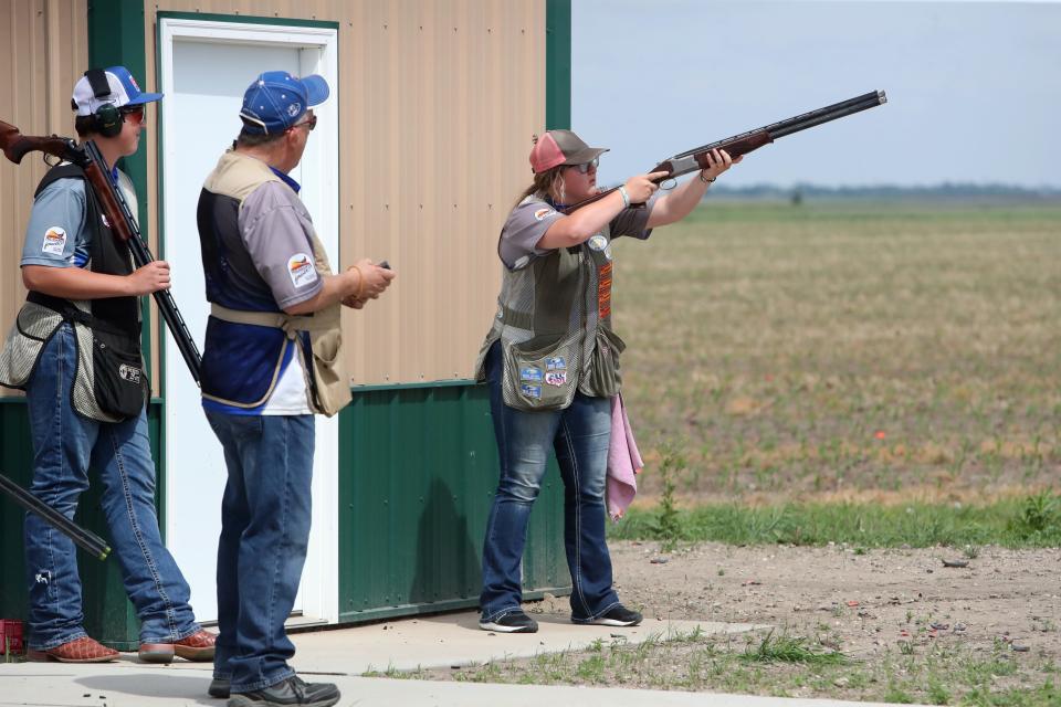 Winner/Colome's Katie Welker shoots at a target Friday during the South Dakota High School Clay Target League State Tournament at the Aberdeen Gun Club. She plans to shoot collegiately at Concordia University in Nebraska.