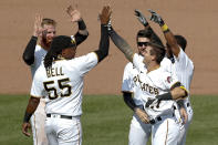 Pittsburgh Pirates' Kevin Newman (27) celebrates with Josh Bell (55) and other teammates after he drove in two runs with a game winning single in the ninth inning of a baseball game against the Minnesota Twins, Thursday, Aug. 6, 2020, in Pittsburgh. The Pirates won 6-5. (AP Photo/Keith Srakocic)