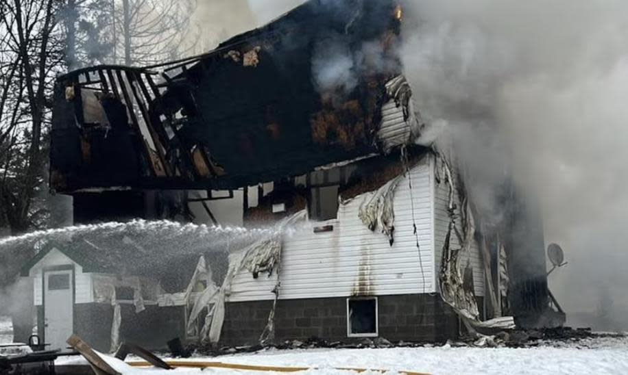 Fire tore through this home in Bowman, Que., at around 8 a.m. on Sunday, Feb. 11, 2024. As of Sunday afternoon, two people were still missing. (S.B./Radio-Canada - image credit)