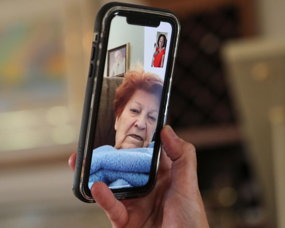 Katie Finn has a video call with her grandmother Carole Gowdy.  Finn who lives in La Quinta is unable to see her grandmother who lives at the Legend Gardens Assisted Living and Memory Care in Palm Desert because of coronavirus concerns, April 24, 2020. 