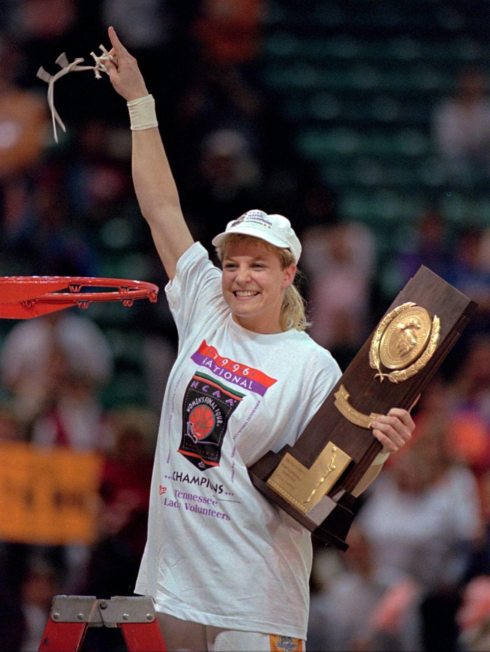 Lady Vols point guard Michelle Marciniak holds the NCAA National Championship trophy after cutting her piece of the net in 1996. Tennessee beat Georgia 83-65 in the title game during Marciniak's senior season.