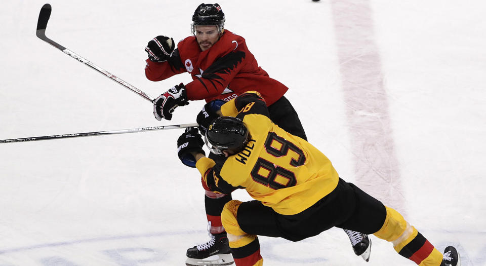 David Wolf of Germany, was taken out by Gilbert Brule on a dirty hit. (Frank Franklin II/AP)