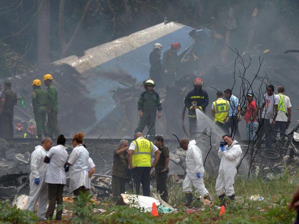 Emergency personnel at the site of the accident near Havana's Jose Marti airport (AFP)