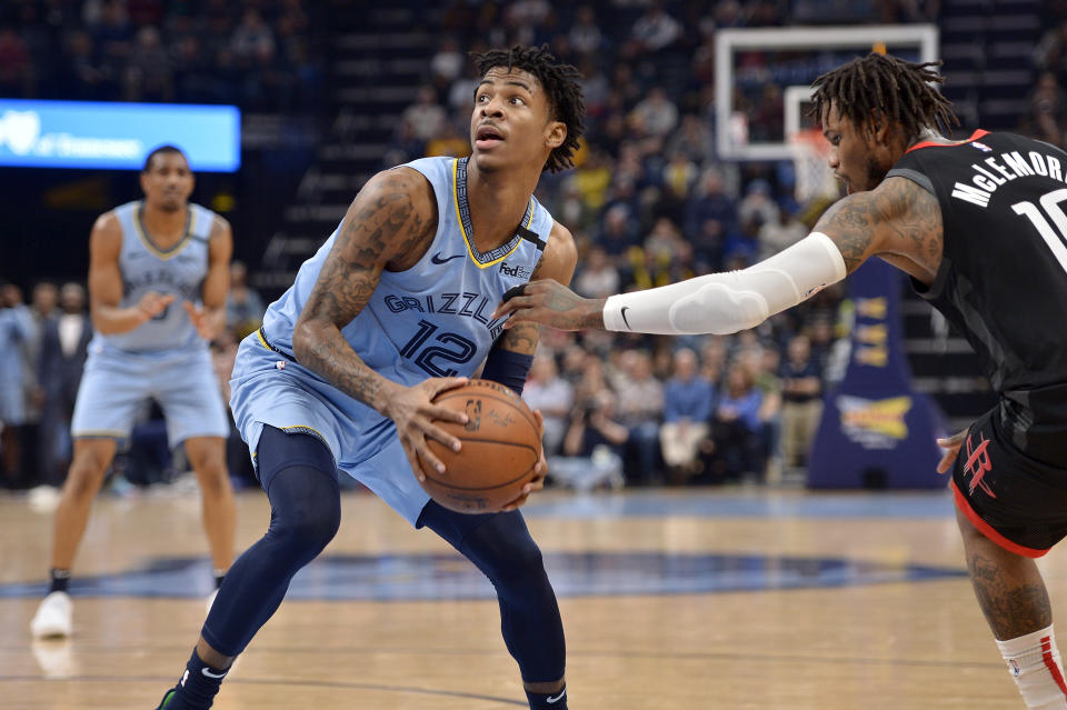 Memphis Grizzlies guard Ja Morant (12) is defended by Houston Rockets guard Ben McLemore (16) in the second half of an NBA basketball game Tuesday, Jan. 14, 2020, in Memphis, Tenn. (AP Photo/Brandon Dill)